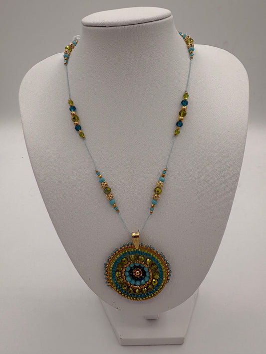 Pendentif en tissage rond bleu vert avec perles Miyuki